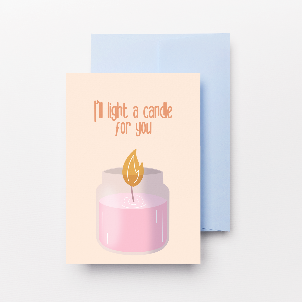A greeting card with a light pink candle illustration and the text 'I'll light a candle for you' in orange, shown with a light blue envelope on a light gray background.