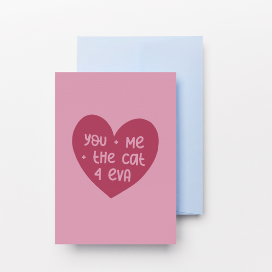 A pink greeting card with a dark red heart graphic containing the text 'you - Me - the cat 4 eva' in pink, shown with a light blue envelope behind it on a clean white background.