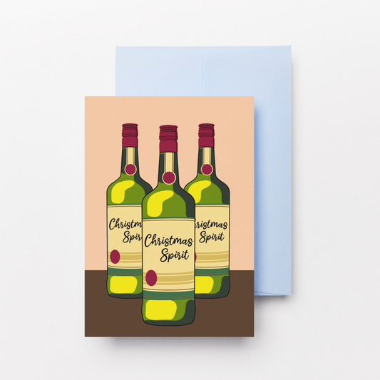A greeting card featuring an illustration of three Christmas spirit bottles, shown with a light blue envelope behind it on a white background.